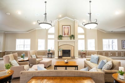 Bright common area with seating and fireplace
