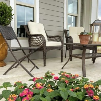 Outdoor seating area with colorful flowers