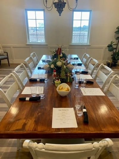 Dining room set for a meal with decor and table settings