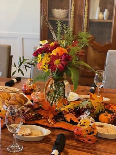 Festively arranged dining table with autumn decorations