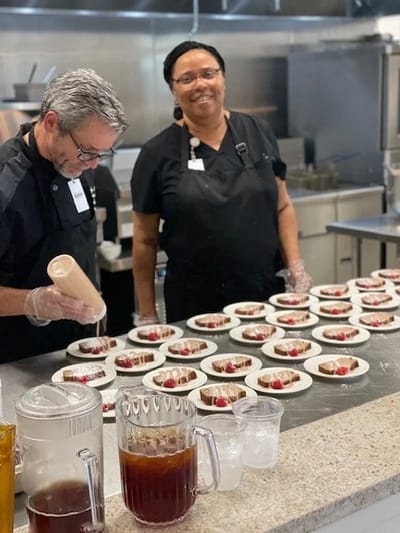 Catering staff preparing meals in the kitchen