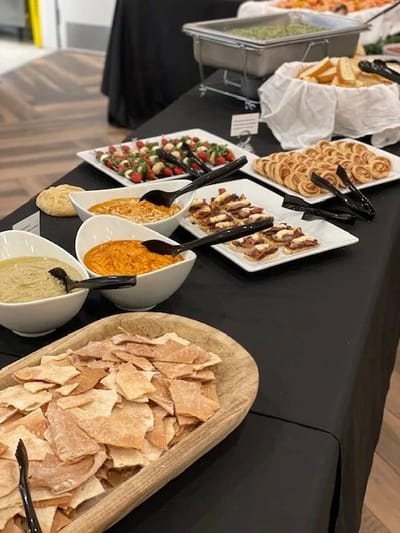 A variety of food items displayed on a buffet table
