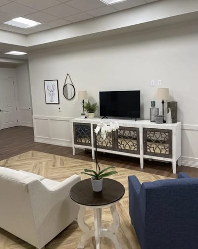 Cozy common area with seating and a TV