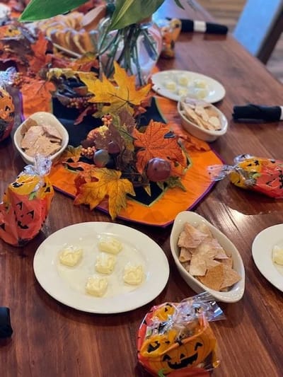 Table setting with seasonal decorations and snacks