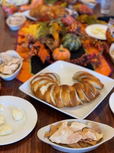 A festive dining table with bread and butter
