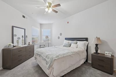 A cozy, well-decorated resident room with natural light