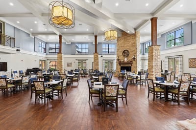 Interior view of a spacious dining room with tables and decor