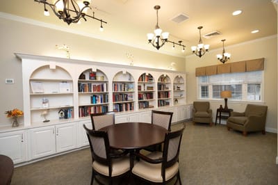 Bright common area with bookshelves and seating