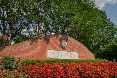 Exterior view of the Asbury entrance with flowers