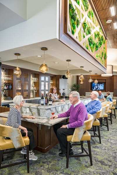 Residents enjoying drinks at the bar area