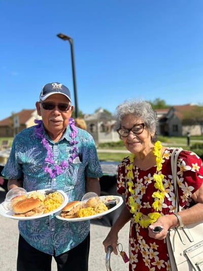 Residents enjoying a meal outside during an event