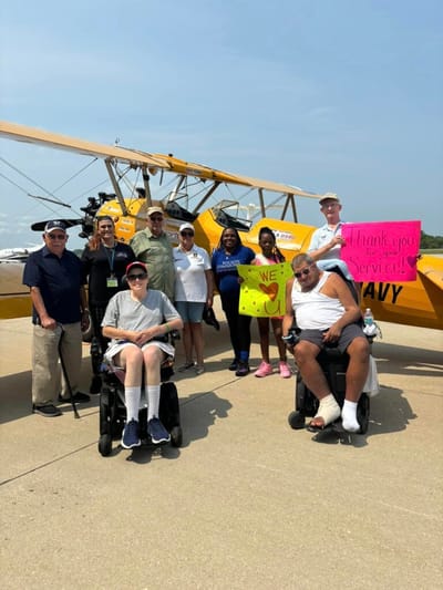 Residents and staff celebrating a special event outdoors