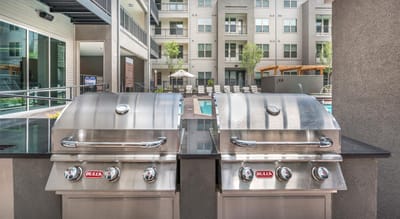 Outdoor barbecue grills near the pool