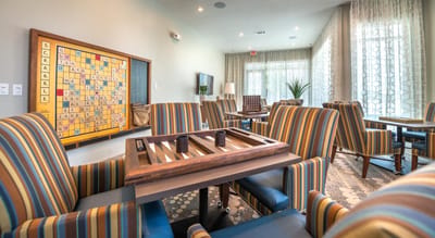 Cozy common area with seating and Scrabble board
