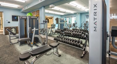 Fitness center with workout equipment and weights