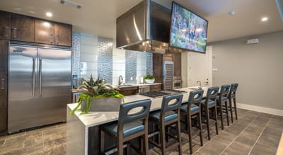 Modern kitchen area with a large island and seating