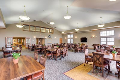 Common area with dining tables and plants