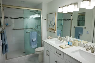 Modern bathroom with double sink and shower