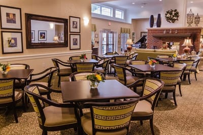 Dining room area with tables and flowers