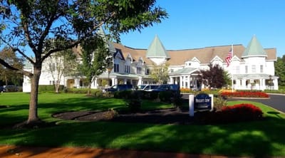 Exterior view of a senior living facility with landscaping
