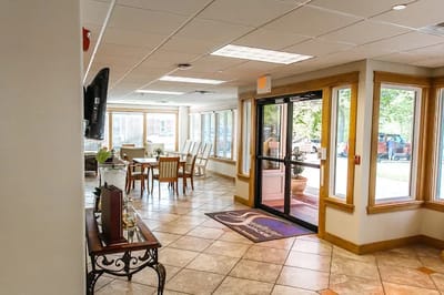Bright common area with tables and chairs