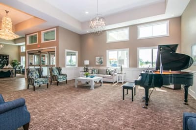 Bright interior lounge area with a grand piano