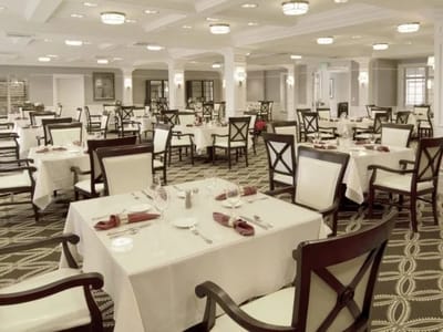 Elegant dining room setup with tables and chairs