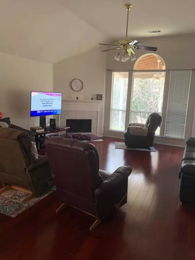 Cozy common area with seating and a television