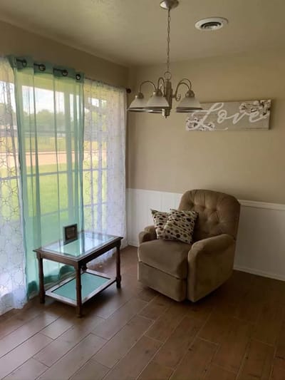 Cozy corner of a room with a chair and table