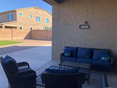 Outdoor seating area with couches and patio