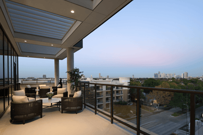Outdoor terrace area with seating and city view