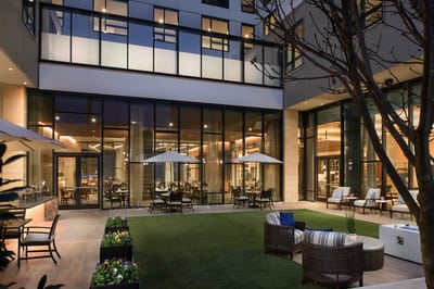 Outdoor seating area with tables and chairs
