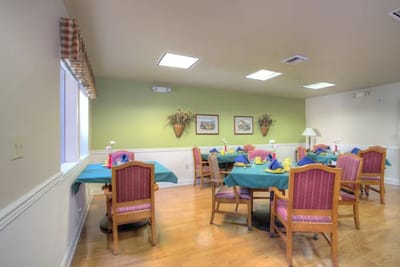 Bright dining room with tables set for a meal