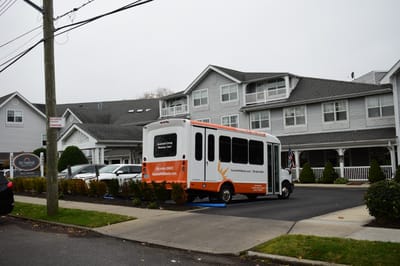 Facility shuttle parked outside the building