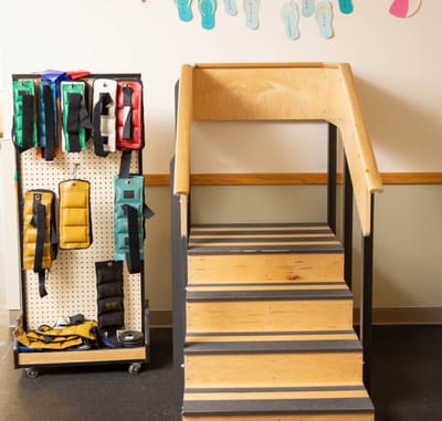 A set of therapy stairs with equipment on display