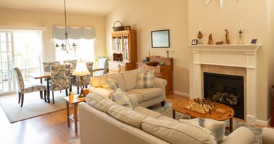 A cozy common area with seating and a chess set