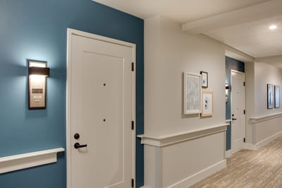 Hallway with resident room doors and decor