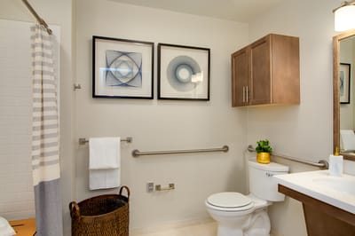 Clean bathroom with modern decor and art