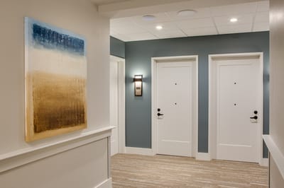Interior hallway with modern artwork and doors