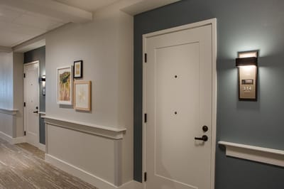 Interior hallway with room doors and artwork