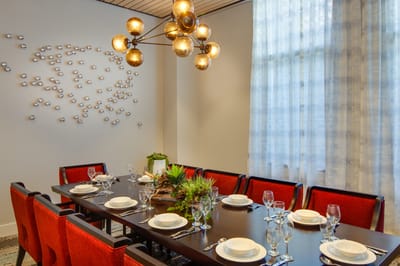 A beautifully set dining room with elegant decor