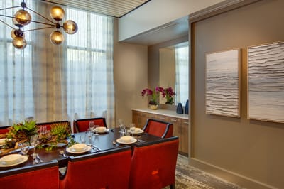 Dining room set with floral decorations and dishes