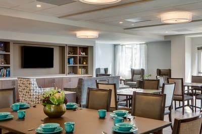 Bright dining room setup with teal dinnerware