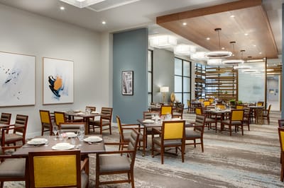 Elegant dining room setup with tables and chairs