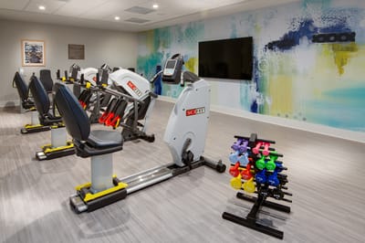 Modern fitness equipment in a well-lit gym area