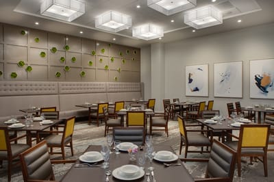 Elegant dining room setup with tables and decorations