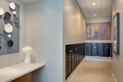 Interior hallway with mailboxes and decorative wall art