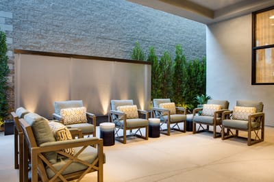 Outdoor seating area with comfortable chairs and plants