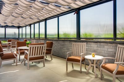 Outdoor seating area with comfortable chairs and tables