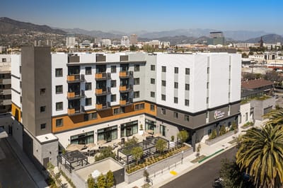 Aerial view of modern assisted living facility with outdoor seating